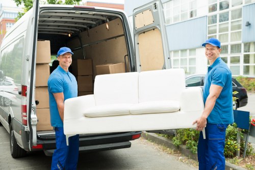 Removal van and movers in an Islington street