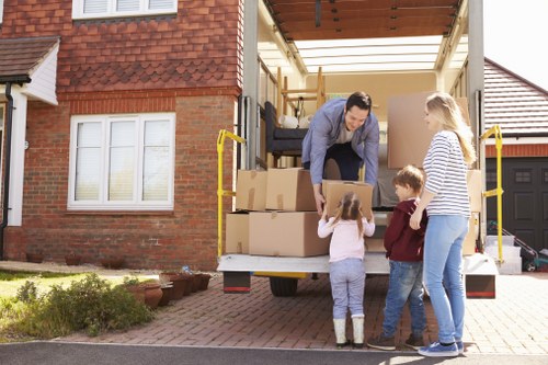 Commercial removals team transporting office equipment in Islington