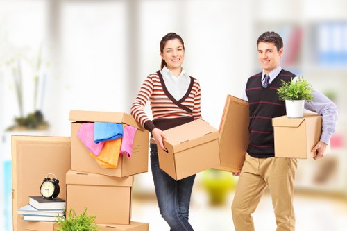 Driver and helper handling furniture during a move