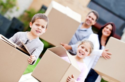 Household boxes and furniture prepared for a moving truck in Islington