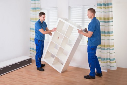 Professional home removal team loading items for an Islington move