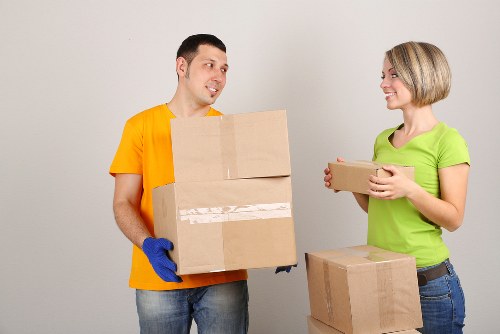 Moving boxes and furniture in an Islington flat
